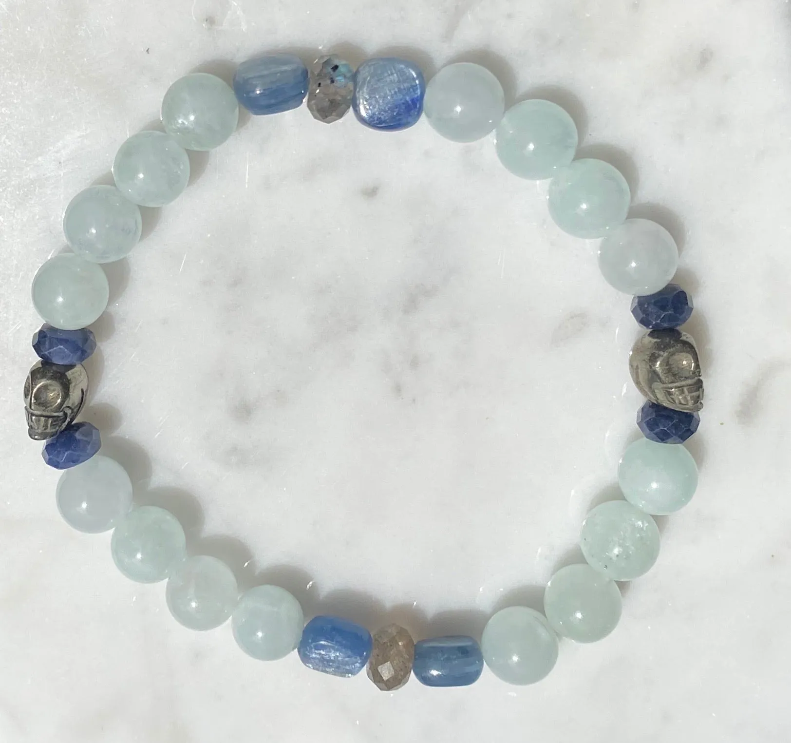 Aquamarine, labradorite, blue sapphires, pyrite skull, and kyanite gemstone bracelet